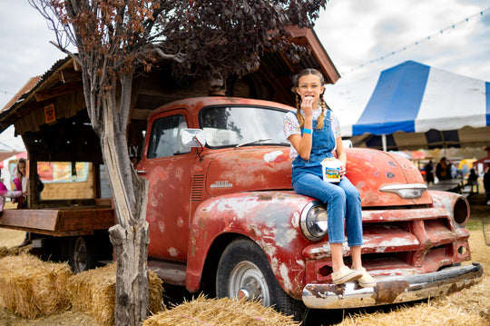 Cookies_Bucket_Girl sitting on truck eating 2_RJ.jpg