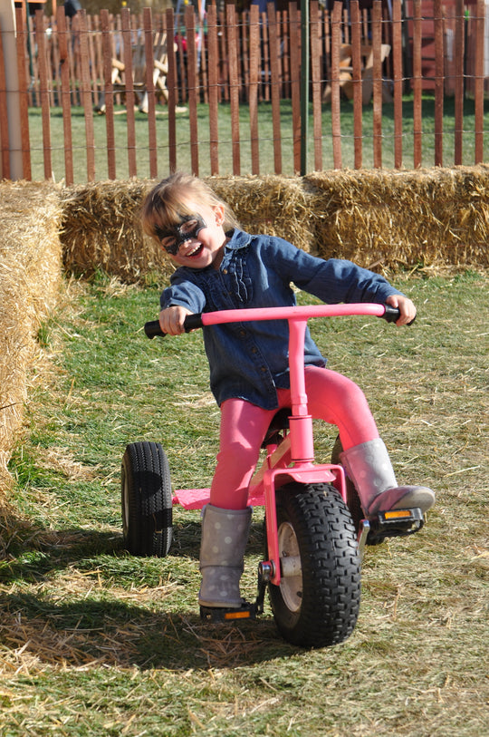 Tricycle_Girl_Laughing Riding.JPG